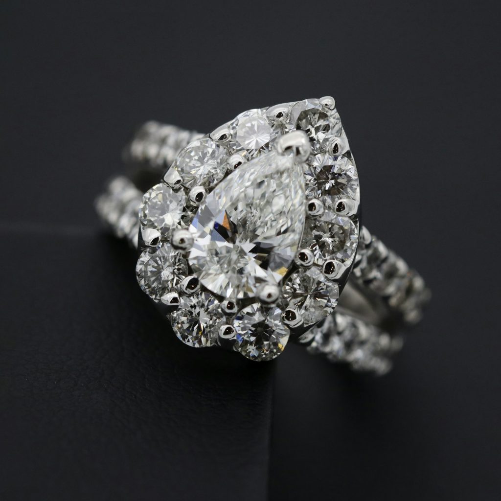A diamond ring on a dark background representing specie and jewellers block insurance