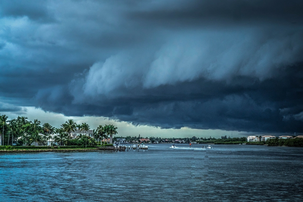 Storm front rolling in over a Florida waterfront ahead of a hurricane